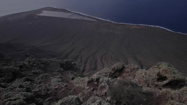 View over the railing around the telescope to the island opposite the island of Lanzarote in the Canary Islands. Shot in motion. Rising shot of opposite island in Lanzarote, Canary Islands. Panoramic 