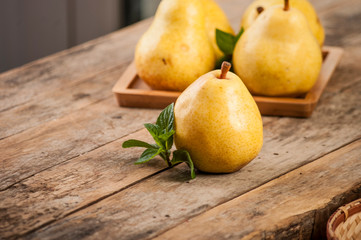 Fruit background. Fresh organic pears on old wood. Pear autumn harvest