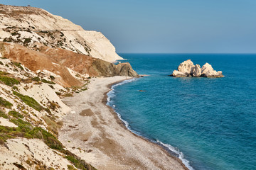 Fototapeta na wymiar Shot of the coast of Aphrodite's birthplace near Paphos city, Cyprus. A popular holiday destination. Tourism, vacation, traveling, leisure concept.