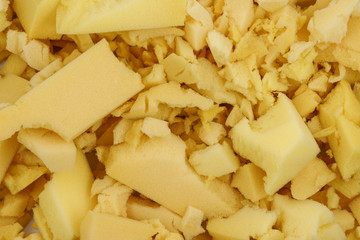 yellow polyurethane foam rubber pieces background texture. stuffing for pillows and furniture