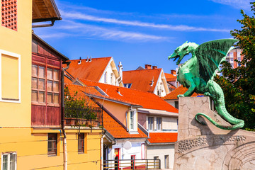 Travel and landmarks of Slovenia - beautiful Ljubljana with famous Dragon's bridge and colorful...