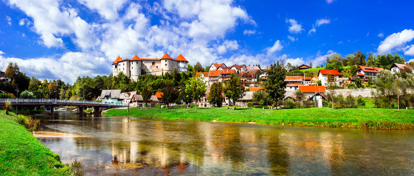 Landmarks of Slovenia - beautiful medieval castle Zuzemberk rising above the Krka River