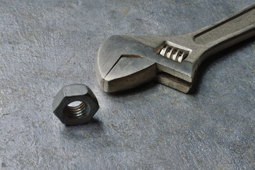 Fototapeta na wymiar adjustable wrench and large nut