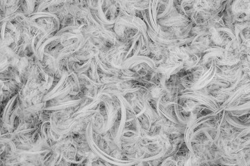 White goose feathers and fluff from pillows texture