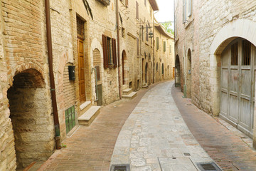 Fototapeta na wymiar Beautiful Italian old city. Typical medieval architecture on street in the heart of Italy.