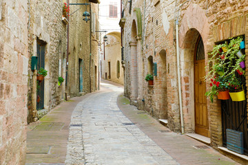 Fototapeta na wymiar Beautiful Italian old city. Typical medieval architecture on cozy street in the heart of Italy.