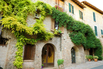 Fototapeta na wymiar Italian old city. Typical Italian medieval houses in old town street in the heart of Italy.