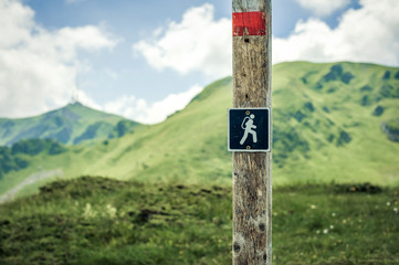 Hiking sign. Road sign board on the mountain. Adventure outdoor