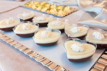Obraz na płótnie Canvas Dessert with white and black chocolate and cream on top