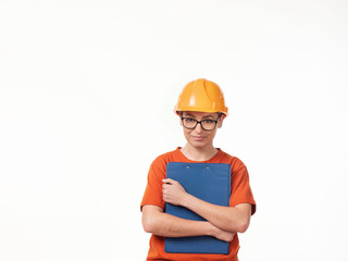 beautiful foreman girl in a yellow helmet with a blue folder on a white background