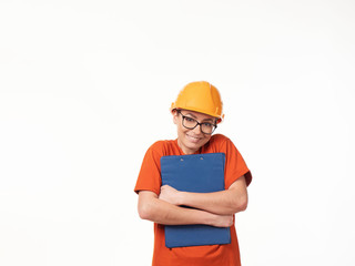 beautiful foreman girl in a yellow helmet with a blue folder on a white background