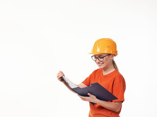 beautiful foreman girl in a yellow helmet with a blue folder on a white background