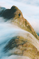 Fototapety  Clouds waterfall over mountains landscape Travel aerial view wilderness nature tranquil serene scenery in Norway