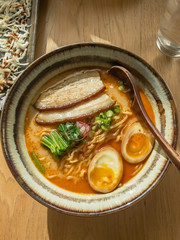 Bowl of Spicy Tonkotsu Ramen at Sunset