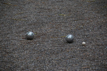 Petanque balls in the pebbles in a European park