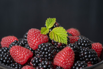 Background from fresh organic blackberries and raspberries,. Close up blackberry and raspberry
