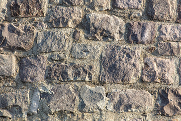 Fototapeta premium Wall of stone blocks as an abstract background