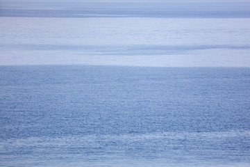 Fototapeta na wymiar Blue expanse of water at sea as abstract background