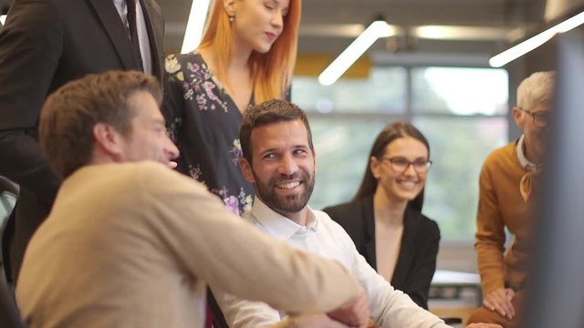 Young business people shake hands in the office for agreement success concept 