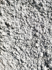 Concrete chips on the wall as abstract background