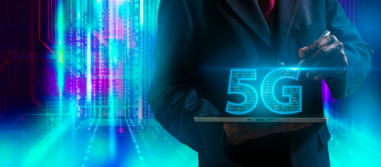 Businessman hand holding icon 5g.5G network digital hologram and internet of things on city background.5G network wireless systems.human hand holding icon 5g.