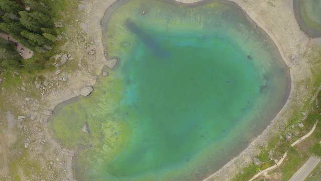 Dolomites Lake Carezza 4K Aerial Top Spin View.Italy Dolomites 4k Footage Drone Shot in UHD 4K