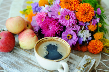 Cup of coffee and flowers