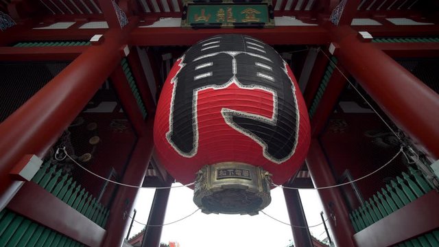 Kaminarimon gate with beautiful red japenese lantern chochin ("wind thunder gate" writen on the red lantern) is the entrance to the Sensoji temple, the oldest temple in Tokyo located in in Asakusa.