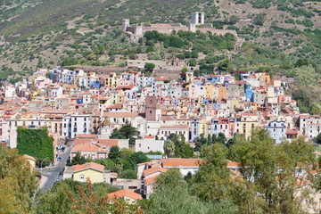 Fototapeta na wymiar Colorful houses in Bosa, Sardinia, Italy. Scenic landscape in Oristano.