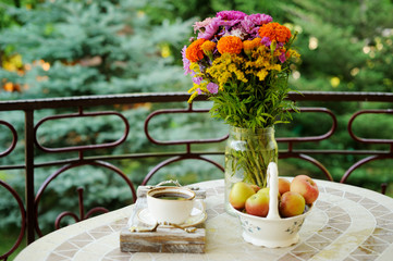 Cup of coffee and flowers