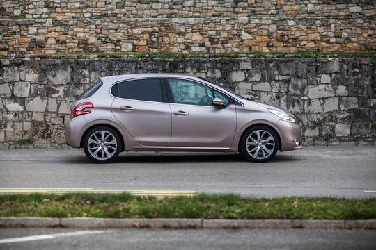 LIPIZA , SLOVENIA DECEMBER 08, 2013: Photo of a Peugeot 208 E-hdi .The Peugeot 208 is a supermini car produced by the French automaker Peugeot and unveiled at the Geneva Motor Show in March 2012. 