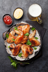 Hot chicken wings and draft beer