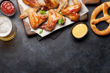 Hot chicken wings and draft beer