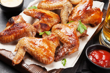 Hot chicken wings and draft beer