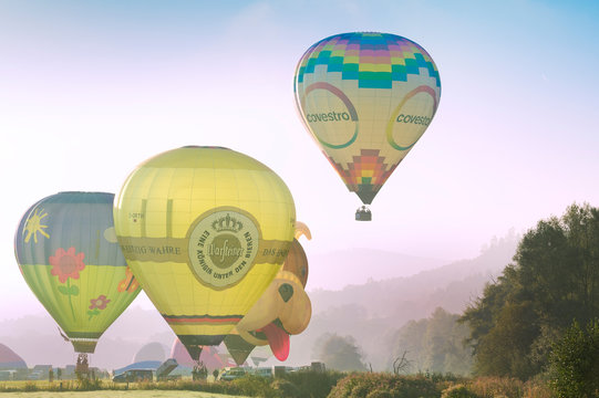 Arnsberg, North Rhine Wesstphalia/Germany - August 31st 2019: Start of the hot air balloons in Oeventrop/Arnsberg in the morning mist. Warsteiner International Montgolfiade is the organizer.
