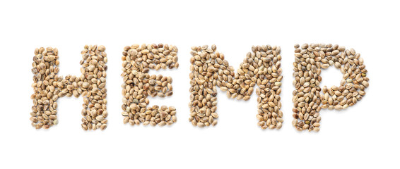 Word HEMP made of seeds on white background, top view