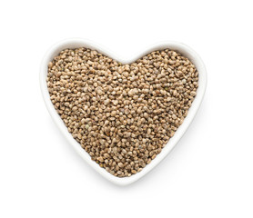 Raw organic hemp seeds on white background, top view