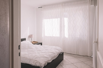 Empty white bedroom