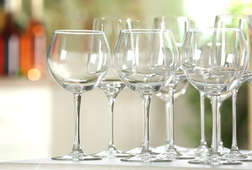 Empty glasses on table against blurred background