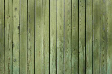 Wooden surface with cracked green paint texture