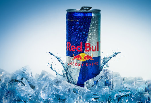 TRIESTE, ITALY-MAY 30, 2016: Aluminium can of Red Bull Energy drink on ice.Isolated on white Background.Red Bull is the most popular energy drink in the world, with 5,226 billion cans sold in 2012.