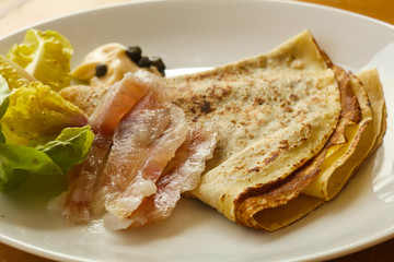 Gravlax with pancake served salad
