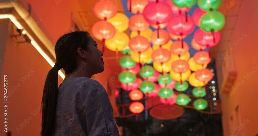 Sticker woman look at the chinese traditional lantern hanging at outdoor in the evening