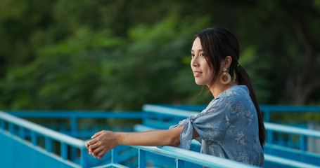 Woman look around the view in the park