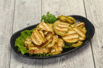 Grilled eggplant slices served basil