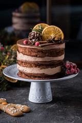 Chocolate Christmas cakedecorated cinnamon and slice of orange