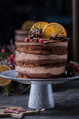  Christmas cake with citrus on a white dishes with green