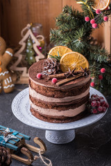  Christmas cake with citrus on a white dishes with green