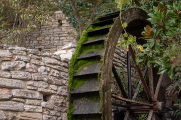 The carriage wheel of a water mill in Portogruaro a town on the river Lemene in the Province Venice in Veneto in Italy © Serge Touch