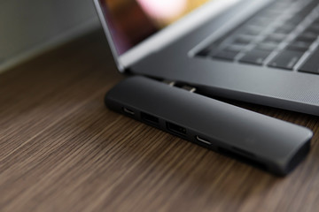 The USB adapter under the Type-C connector for laptop. Multiport station for laptop with multiple different ports. USB to USB Type-C Hub Converter.